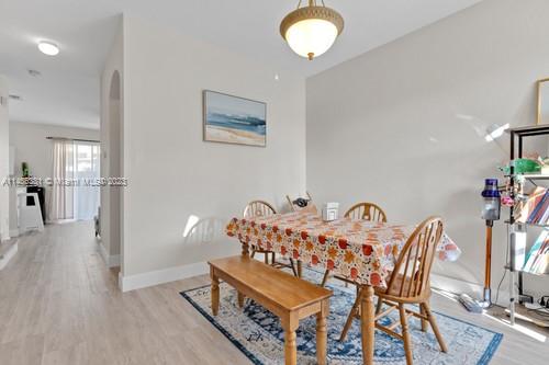 13234 Southwest 128th Path Miami, FL 33186 - Photo 10 of 38 a view of a dining room with furniture and wooden floor
