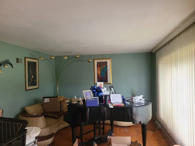 a dining room with furniture and window