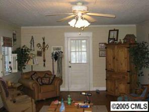 2203 Braswell-Rushing Road Monroe, NC 28110 - Photo 6 of 8 a living room with furniture and a chandelier