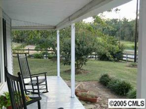 2203 Braswell-Rushing Road Monroe, NC 28110 - Photo 7 of 8 a view of a balcony with garden and patio