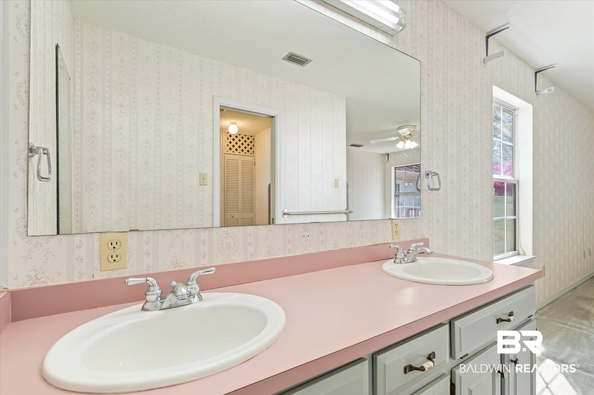 6030 Lott Road Eight Mile, AL 36613 - Photo 11 of 21 Full bathroom with wallpapered walls, a sink, and double vanity