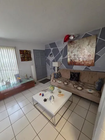 a workspace with furniture and wooden floor