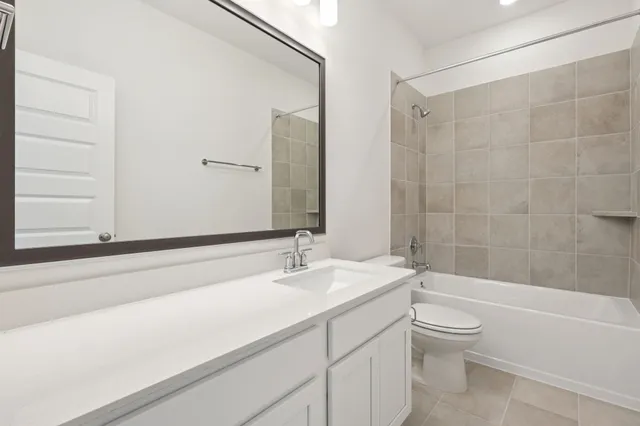 a bathroom with a sink a toilet and a bathtub