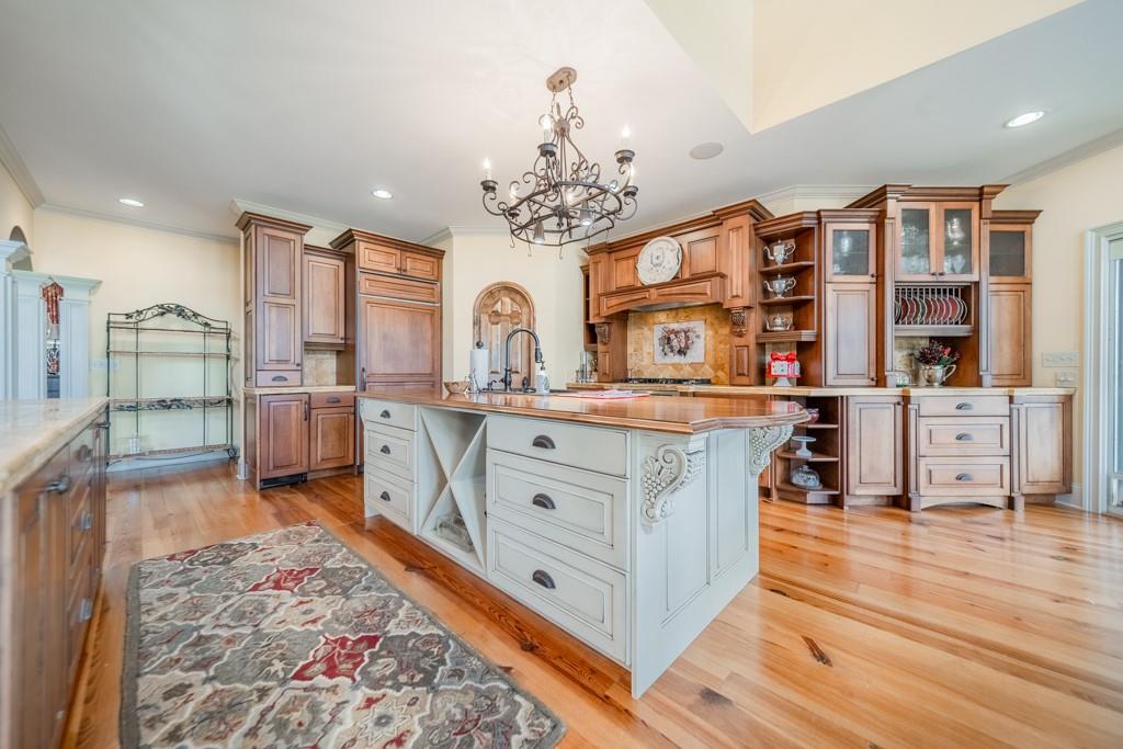 130 Chandelle Ridge Drive Woodruff, SC 29388 - Photo 16 of 45 a large kitchen with stainless steel appliances granite countertop a lot of counter space and wooden floor