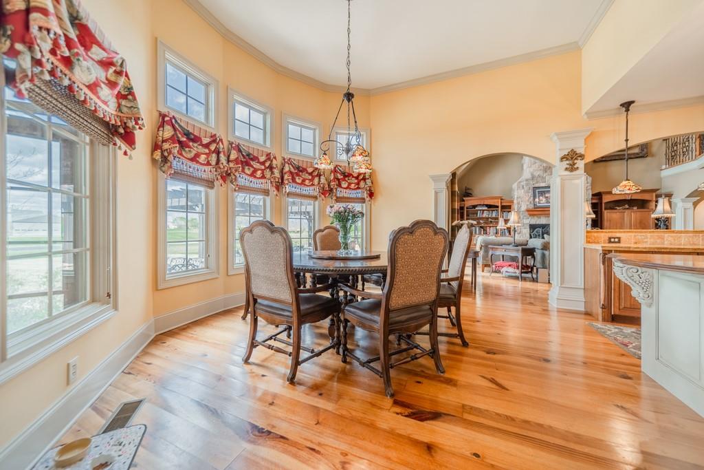 130 Chandelle Ridge Drive Woodruff, SC 29388 - Photo 19 of 45 a dining room with furniture a chandelier and wooden floor