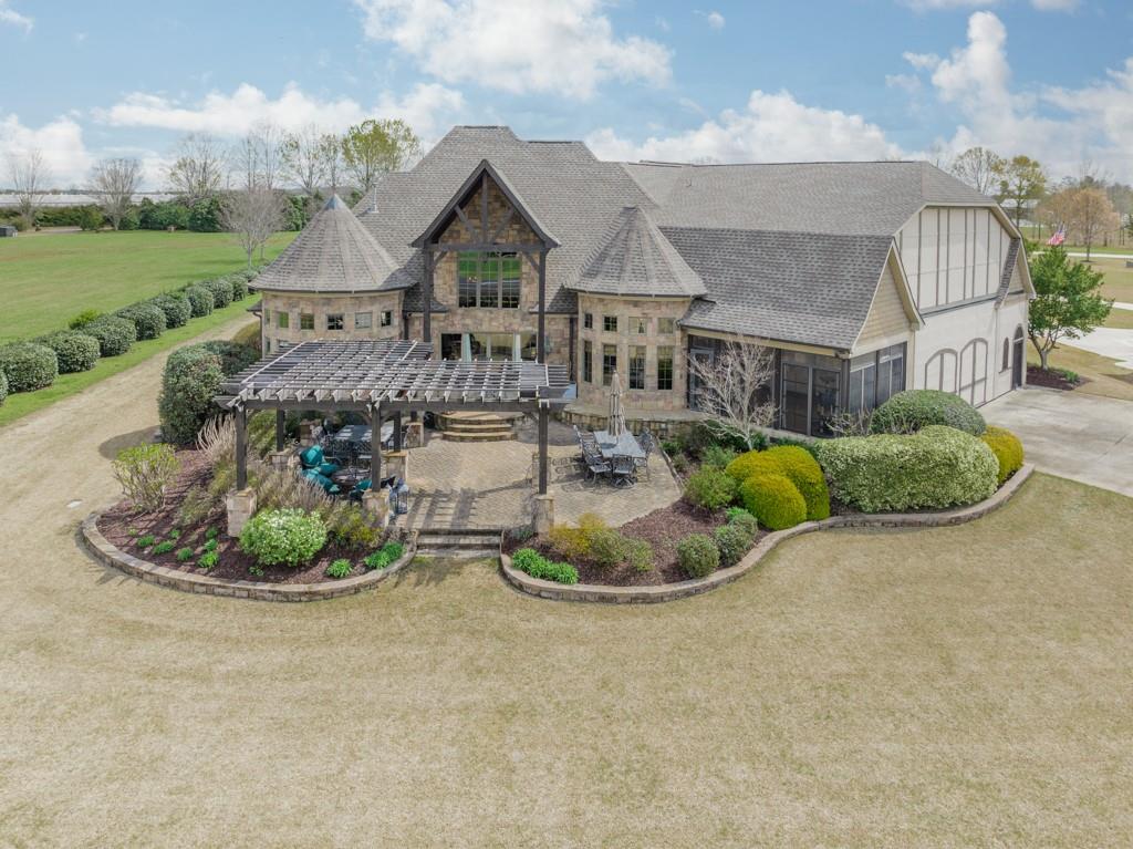 130 Chandelle Ridge Drive Woodruff, SC 29388 - Photo 2 of 45 a front view of a house with a yard fountain and outdoor seating