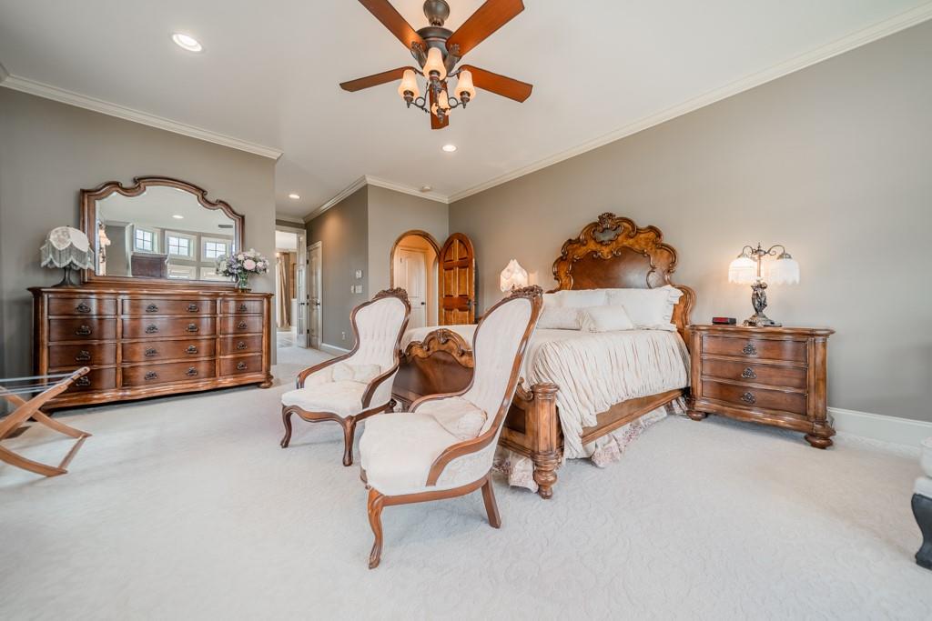 130 Chandelle Ridge Drive Woodruff, SC 29388 - Photo 22 of 45 a bedroom with furniture and a chandelier