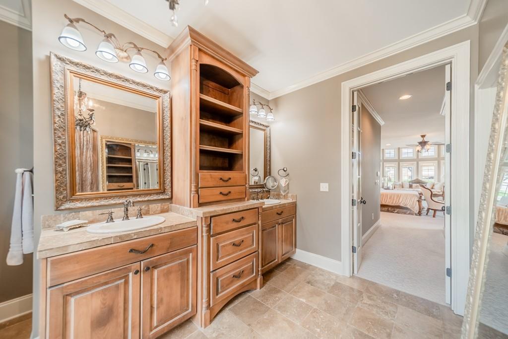 130 Chandelle Ridge Drive Woodruff, SC 29388 - Photo 24 of 45 a spacious bathroom with a shower sink and mirror