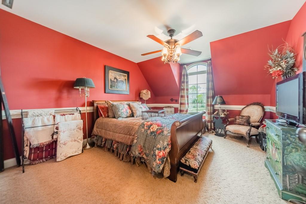 130 Chandelle Ridge Drive Woodruff, SC 29388 - Photo 28 of 45 a bed room with a bed and a chandelier
