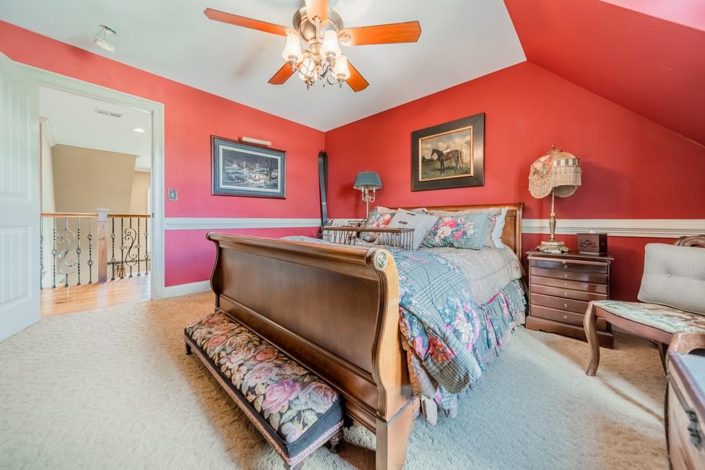130 Chandelle Ridge Drive Woodruff, SC 29388 - Photo 29 of 45 a bedroom with furniture and a chandelier