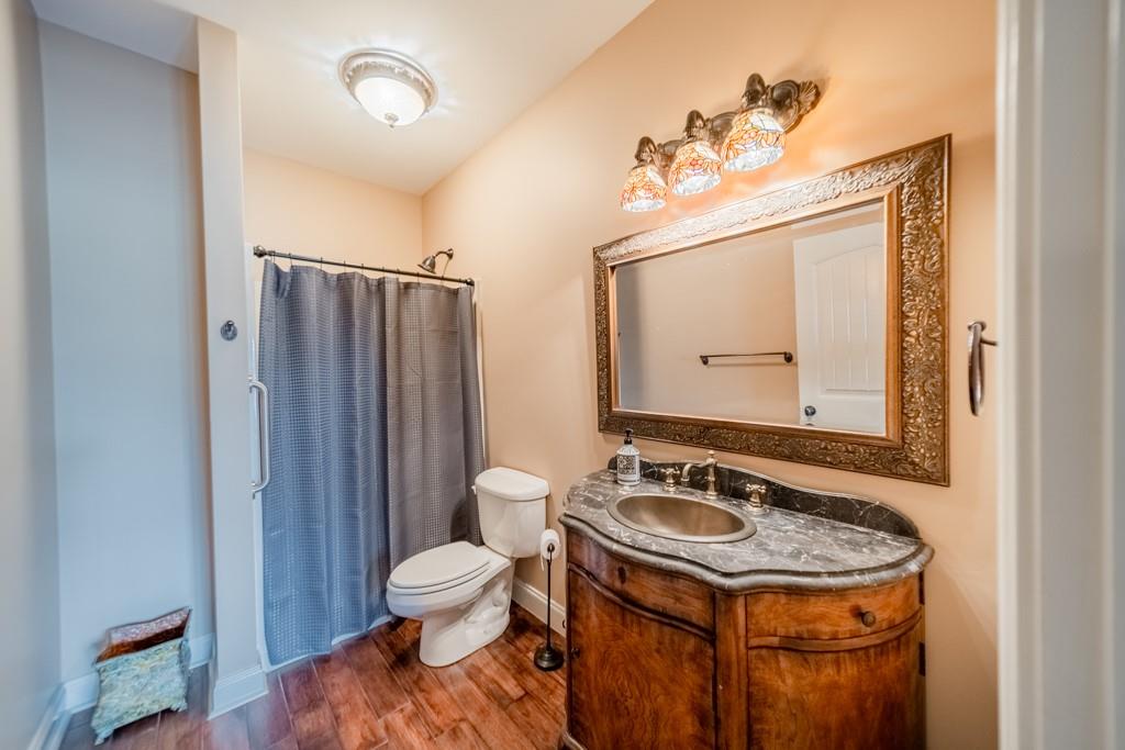 130 Chandelle Ridge Drive Woodruff, SC 29388 - Photo 42 of 45 a bathroom with a sink a toilet and mirror