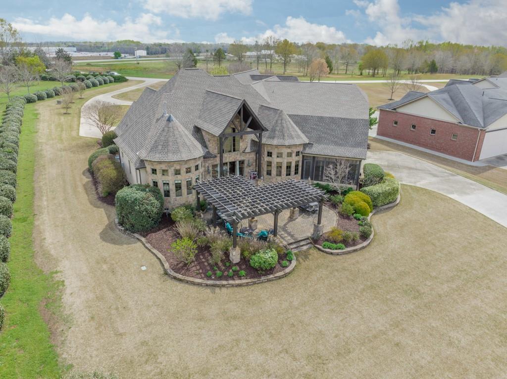 130 Chandelle Ridge Drive Woodruff, SC 29388 - Photo 6 of 45 an aerial view of a house with a garden and pool