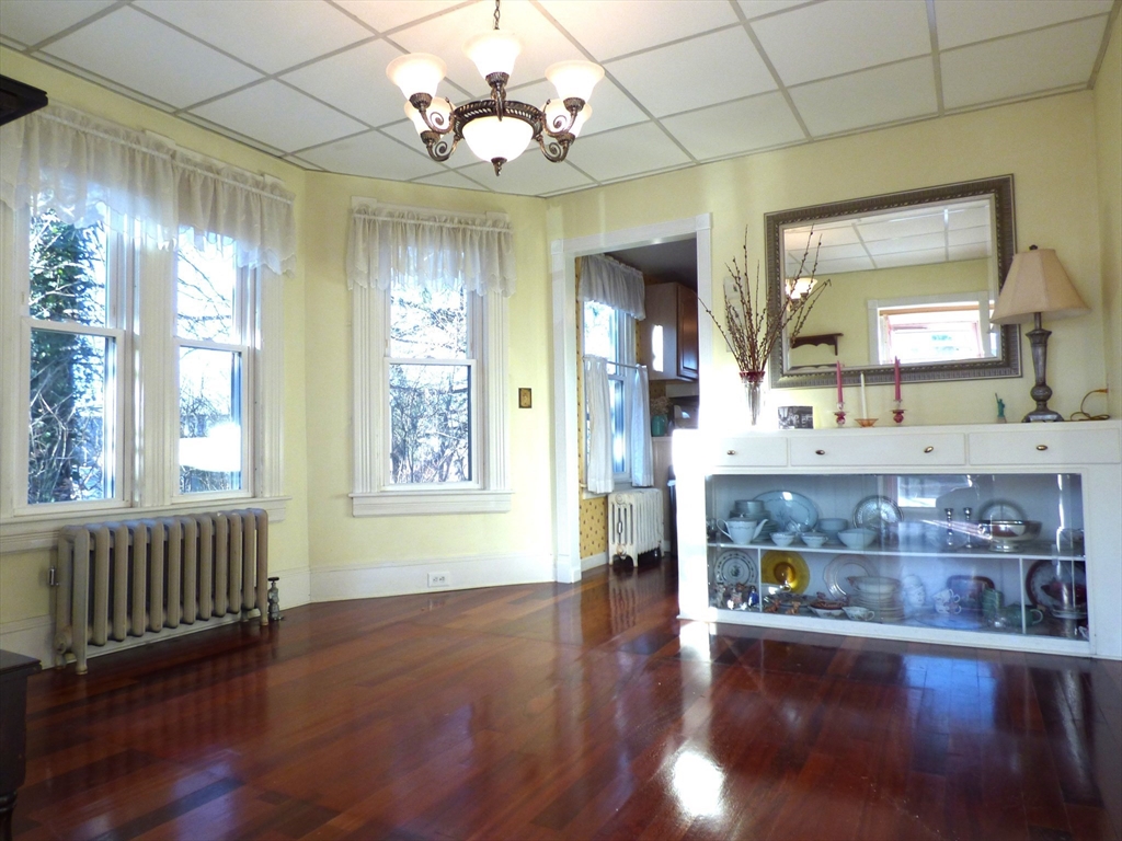 298 Main Street Springfield, MA 01151 - Photo 11 of 40 a view of a room with wooden flooring and chairs