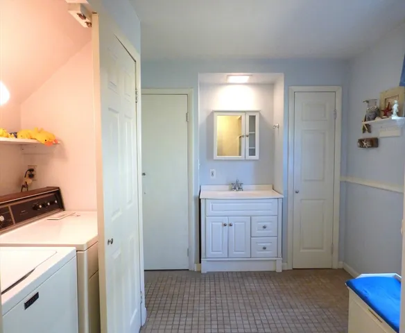 a room with a stove and a sink