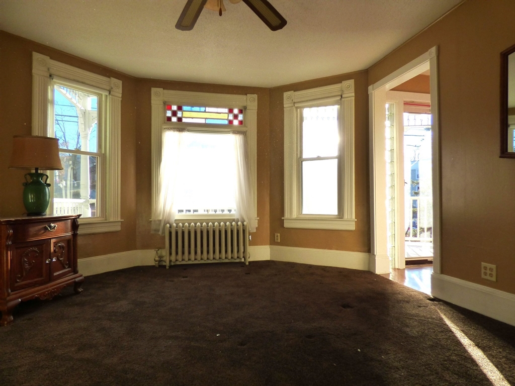 298 Main Street Springfield, MA 01151 - Photo 17 of 40 a view of an empty room with a window