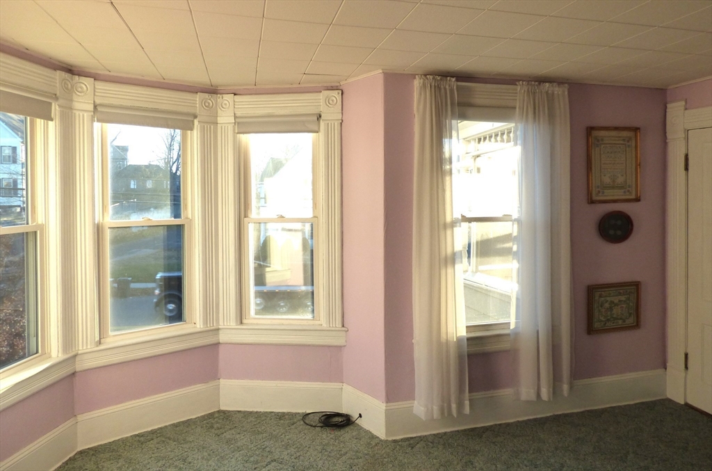 298 Main Street Springfield, MA 01151 - Photo 23 of 40 a view of an empty room with a window