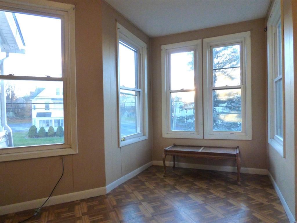298 Main Street Springfield, MA 01151 - Photo 33 of 40 a view of a room with wooden floor and windows
