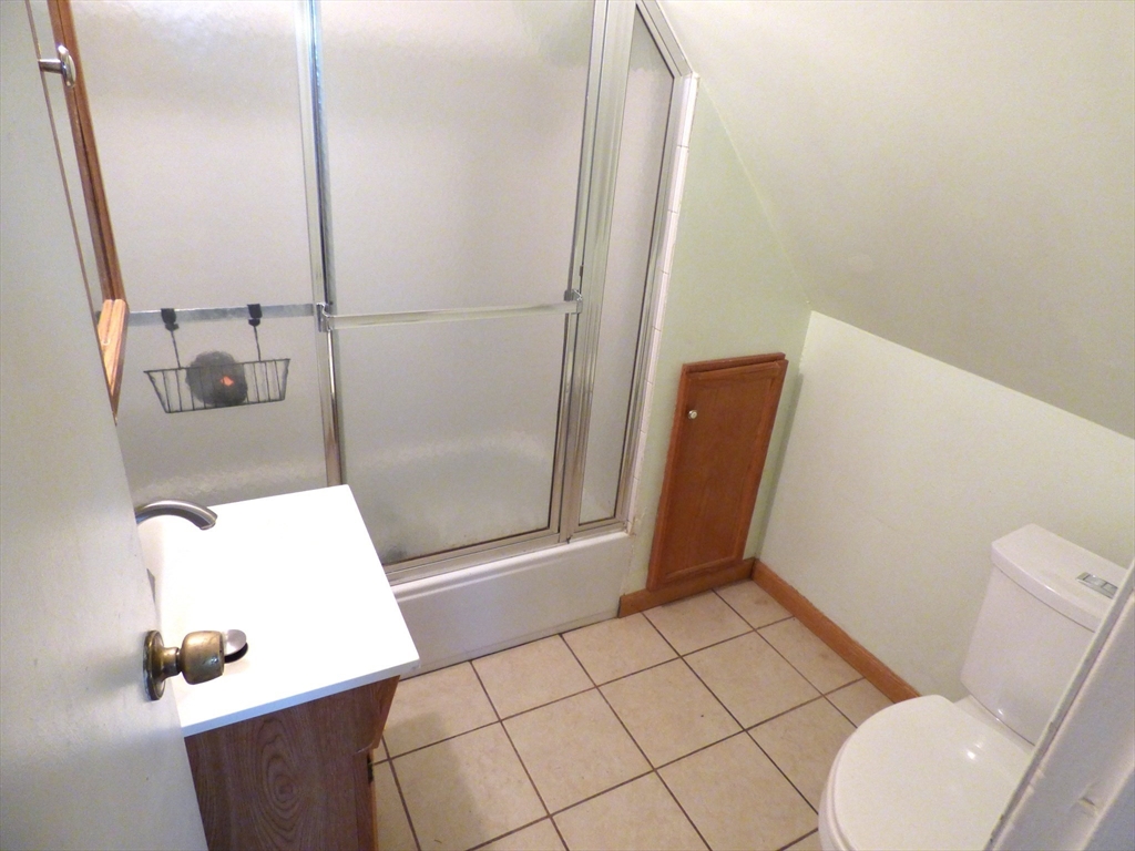 298 Main Street Springfield, MA 01151 - Photo 34 of 40 a bathroom with a sink and a mirror