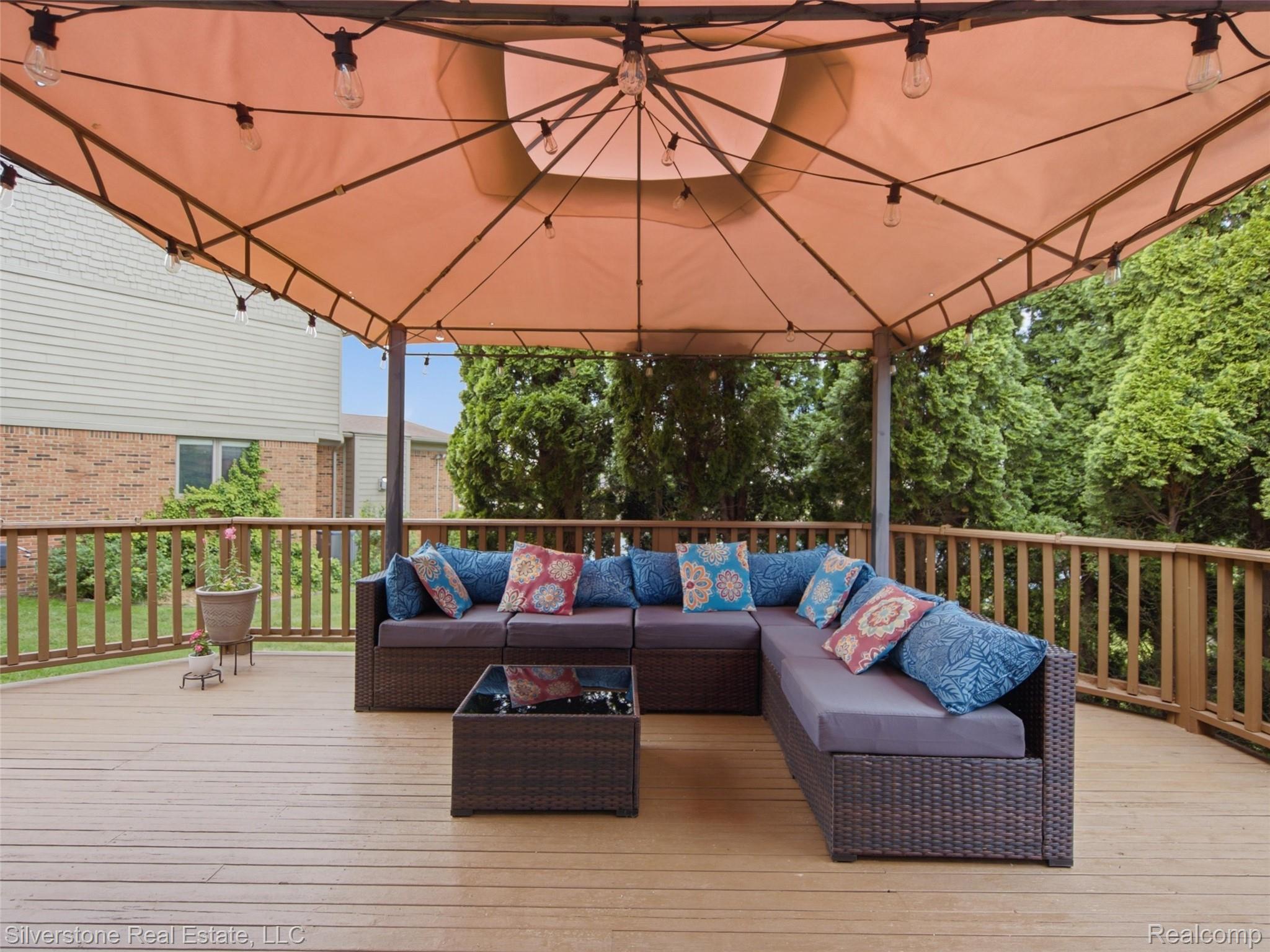 6577 Edith Court Troy, MI 48085 - Photo 49 of 61 Spacious outdoor deck featuring a light brown wood-finish surface and a perimeter railing