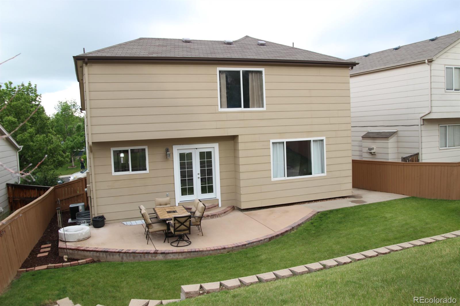 9611 South Castle Ridge Circle Highlands Ranch, CO 80129 - Photo 23 of 25 a view of backyard of house with seating space