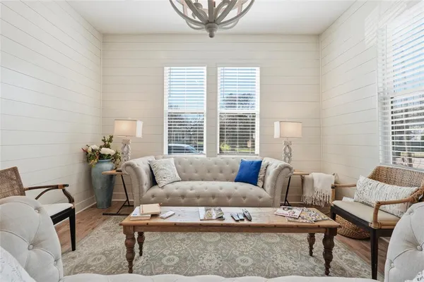 a living room with furniture and a window