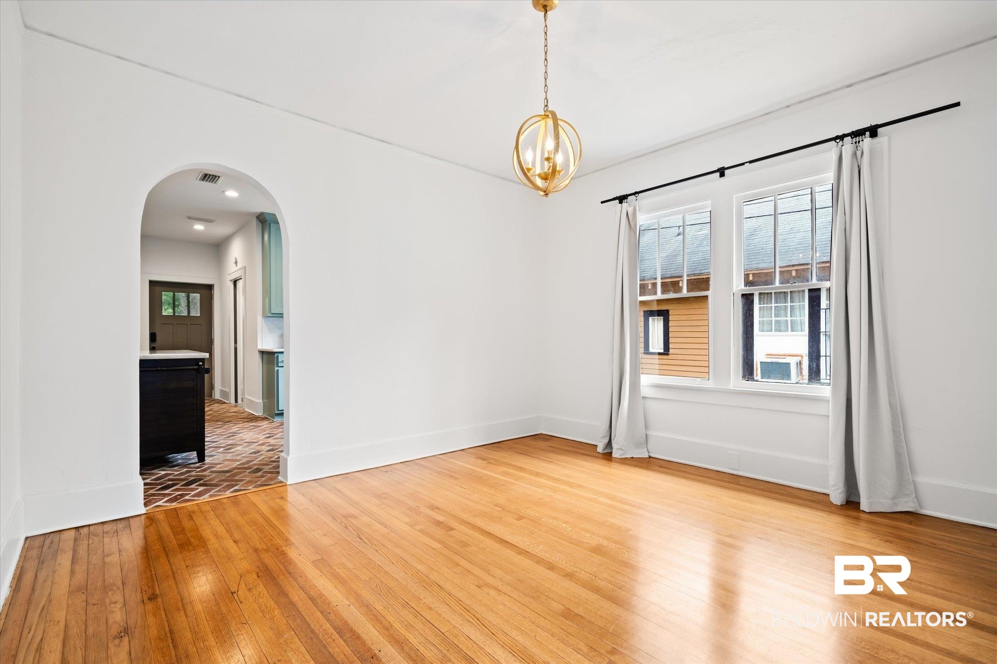 308 South Ann Street Mobile, AL 36604 - Photo 6 of 30 Unfurnished room with a chandelier and light hardwood / wood-style floors