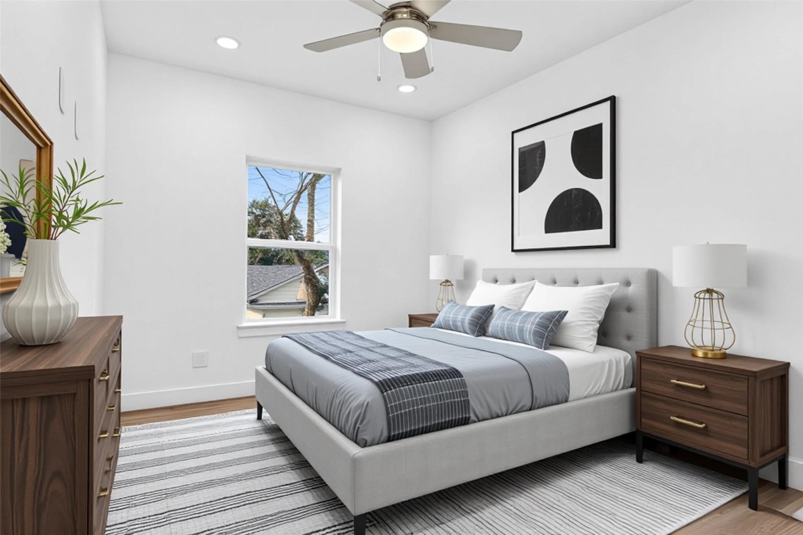 10232 Porto Rico Road Houston, TX 77041 - Photo 26 of 30 a bedroom with a bed and a chandelier
