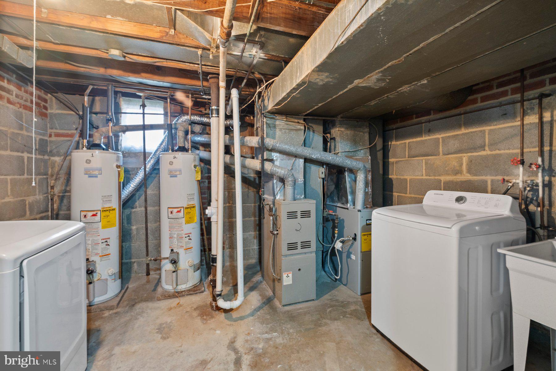 883 Bellevue Street Southeast, Unit 2 Washington, DC 20032 - Photo 36 of 37 a utility room with dryer and washer