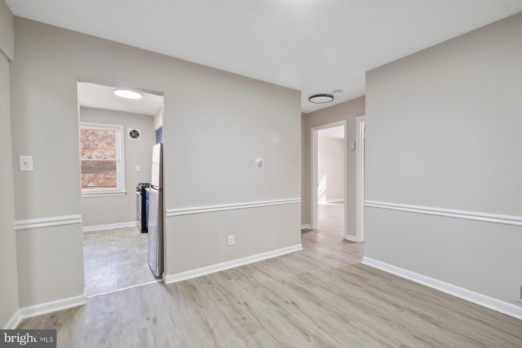 883 Bellevue Street Southeast, Unit 2 Washington, DC 20032 - Photo 8 of 37 wooden floor in an empty room