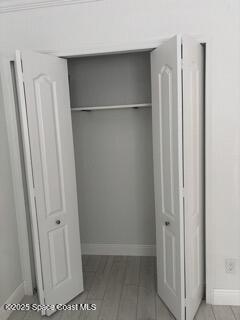 1704 University Lane, Unit 703 Cocoa, FL 32922 - Photo 16 of 18 a view of walk in closet with empty racks