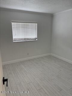 1704 University Lane, Unit 703 Cocoa, FL 32922 - Photo 5 of 18 an empty room with a window