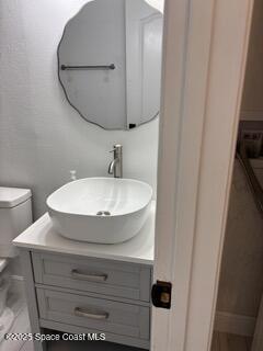 1704 University Lane, Unit 703 Cocoa, FL 32922 - Photo 10 of 18 a bathroom with a sink and mirror