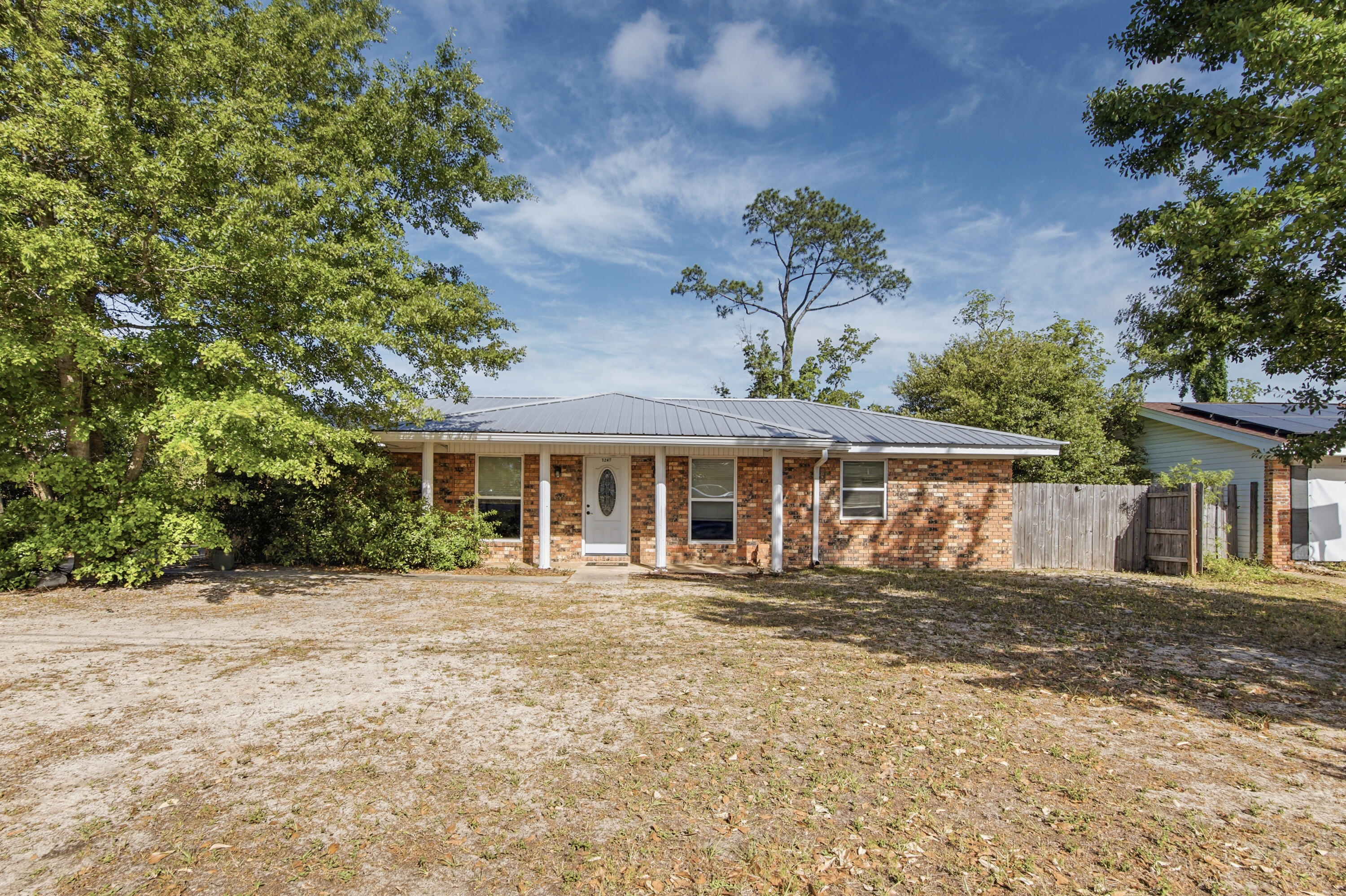 front view of a house with a garden