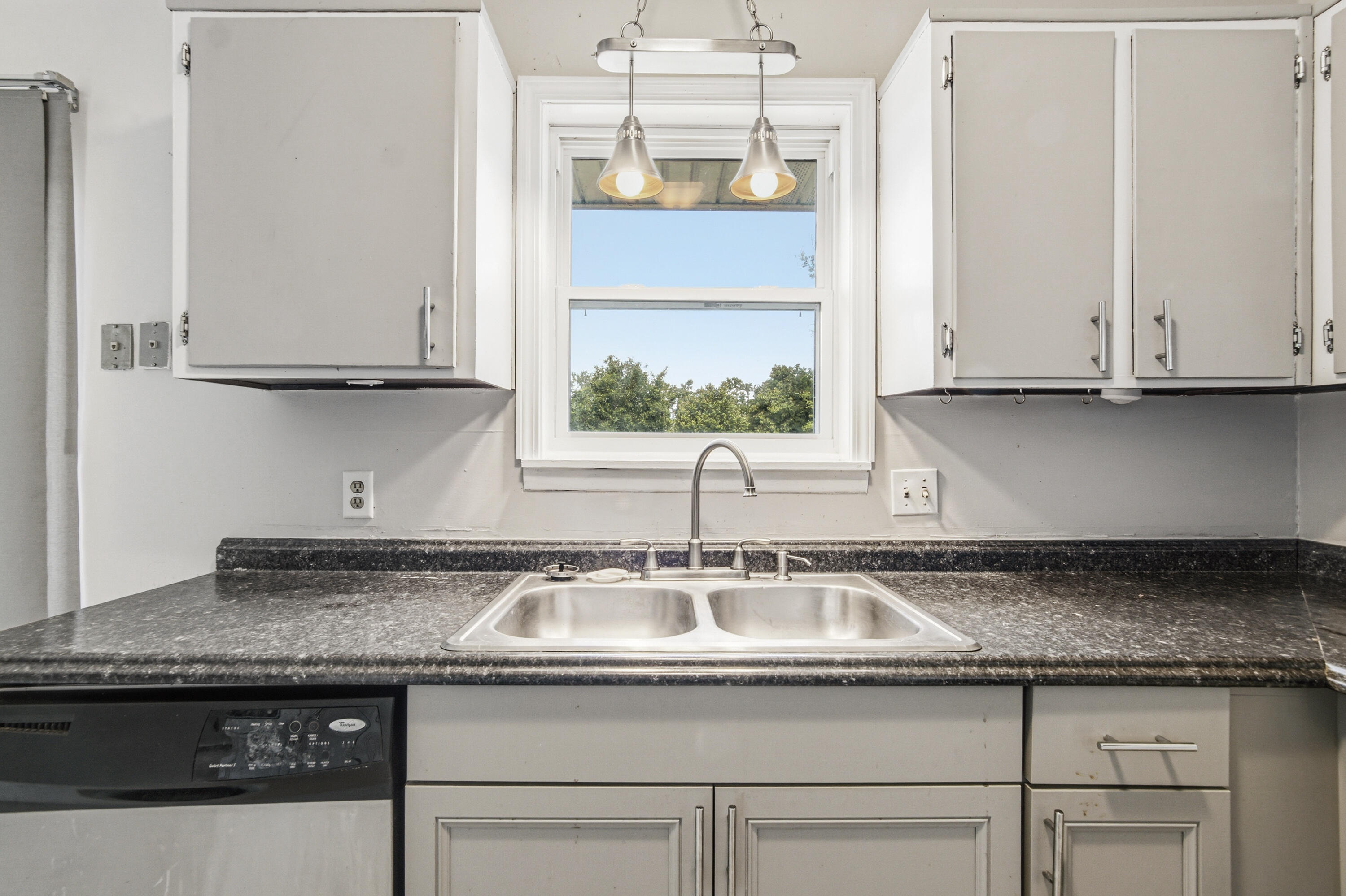 1247 Amherst Road Panama City, FL 32405 - Photo 11 of 28 a kitchen with granite countertop a sink and a stove