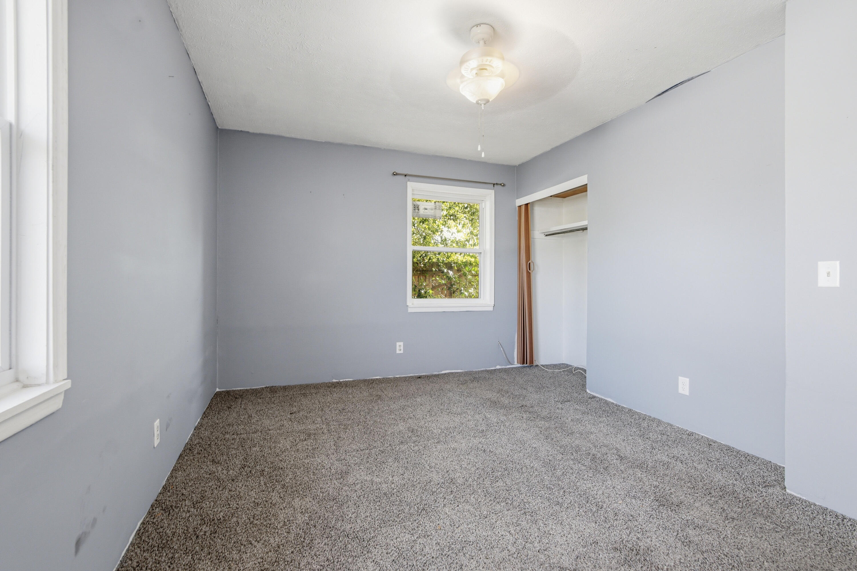 1247 Amherst Road Panama City, FL 32405 - Photo 14 of 28 an empty room with windows