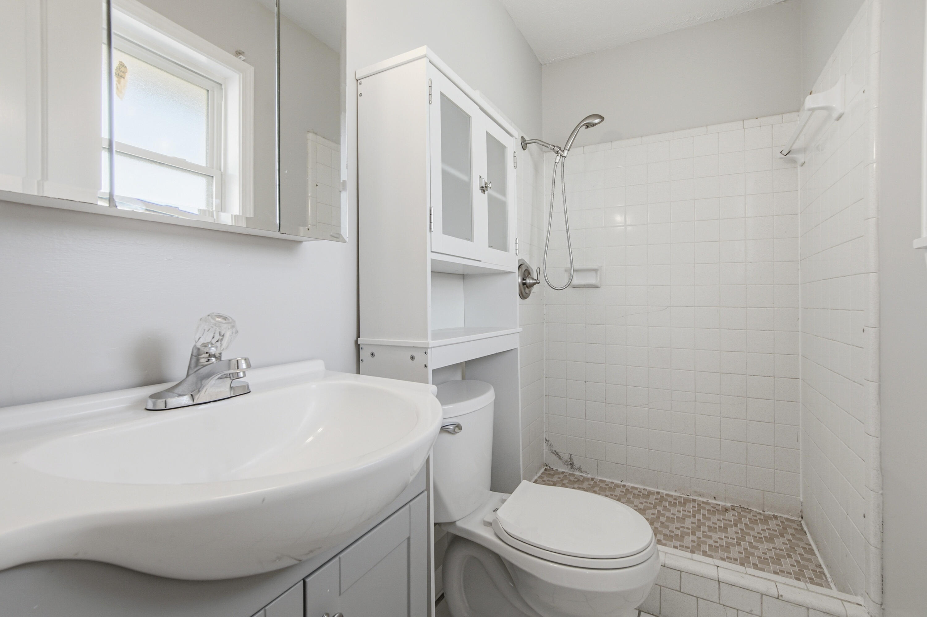 1247 Amherst Road Panama City, FL 32405 - Photo 17 of 28 a bathroom with a sink toilet and shower
