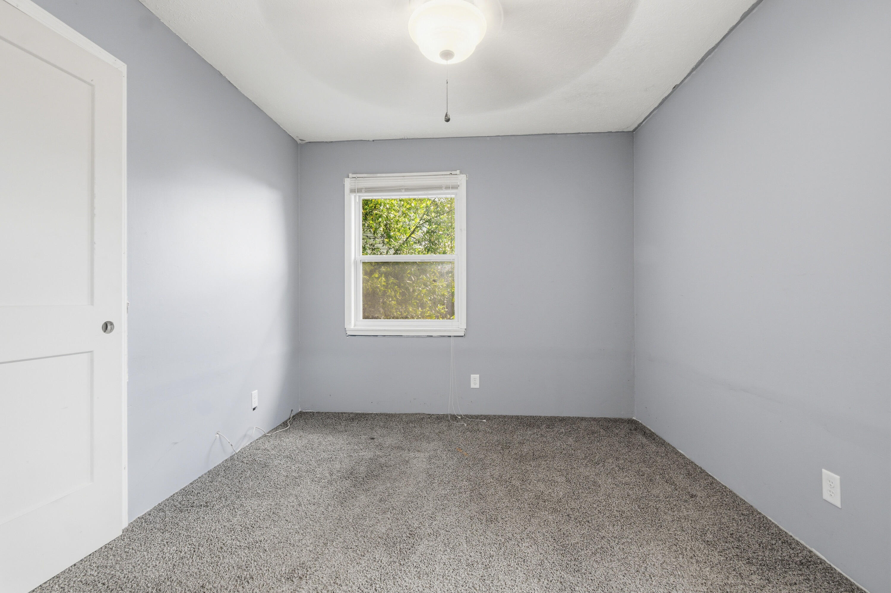 1247 Amherst Road Panama City, FL 32405 - Photo 18 of 28 an empty room with a window