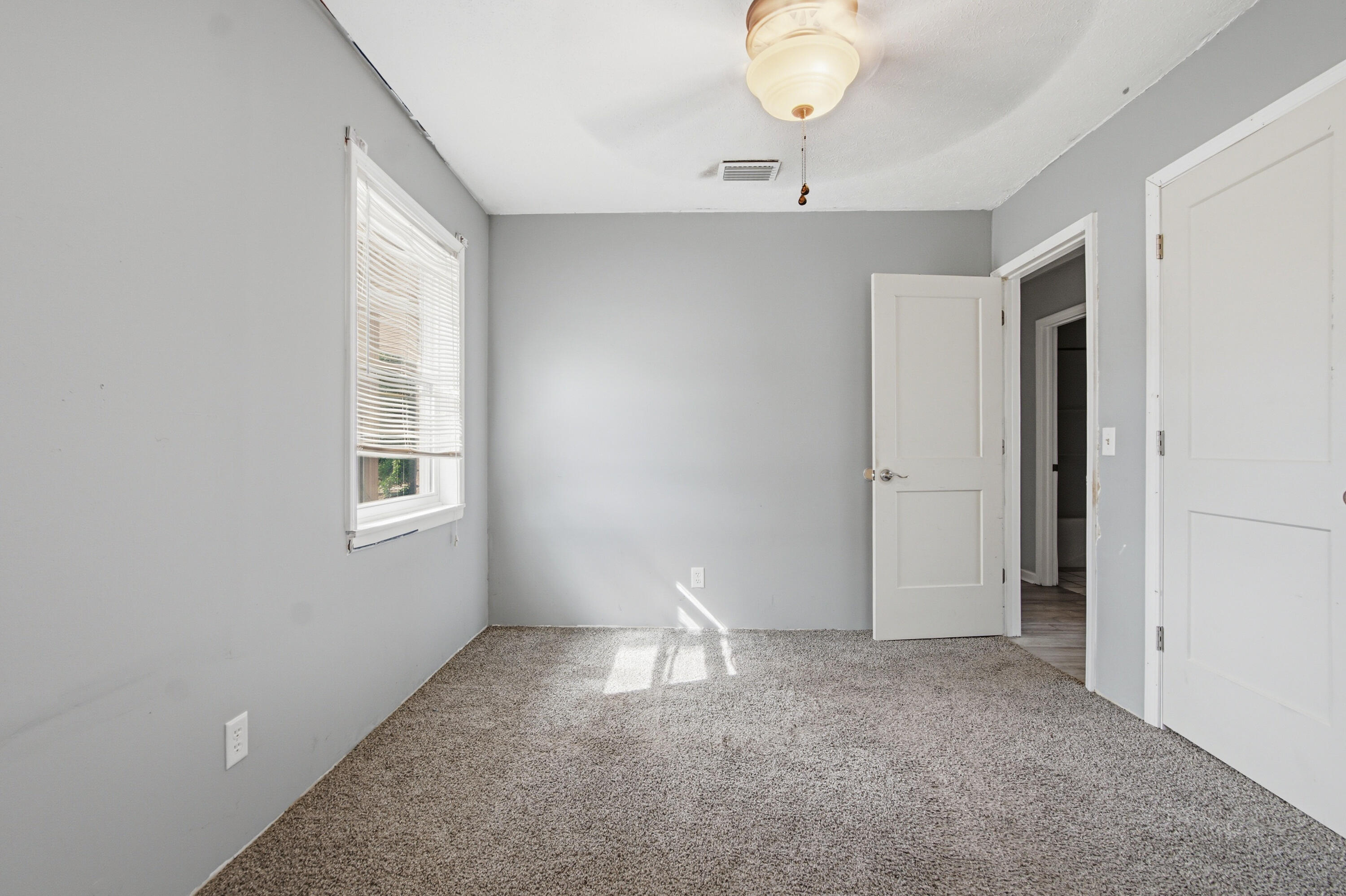 1247 Amherst Road Panama City, FL 32405 - Photo 19 of 28 a view of empty room with windows