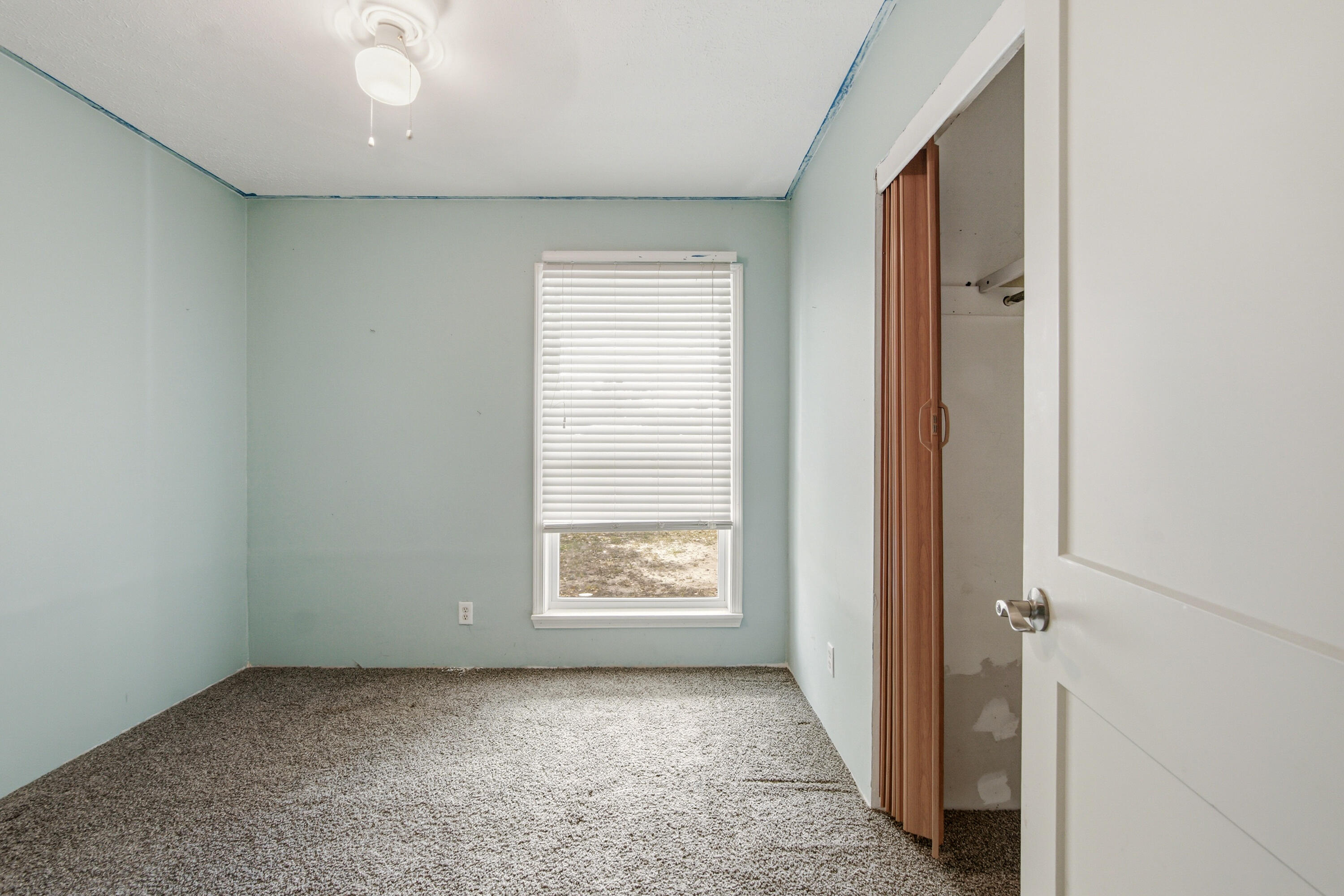1247 Amherst Road Panama City, FL 32405 - Photo 20 of 28 an empty room with windows