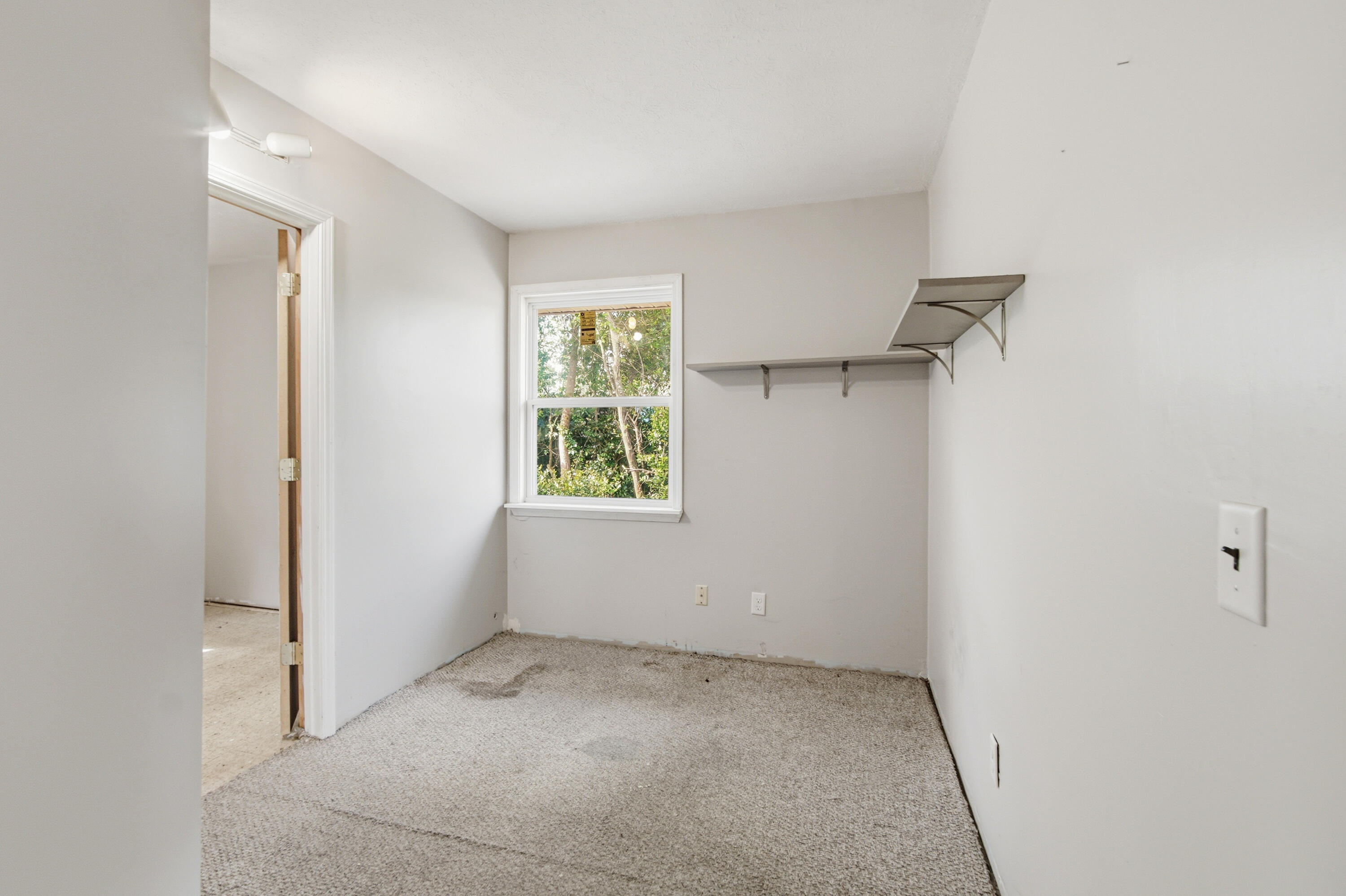 1247 Amherst Road Panama City, FL 32405 - Photo 24 of 28 an empty room with windows