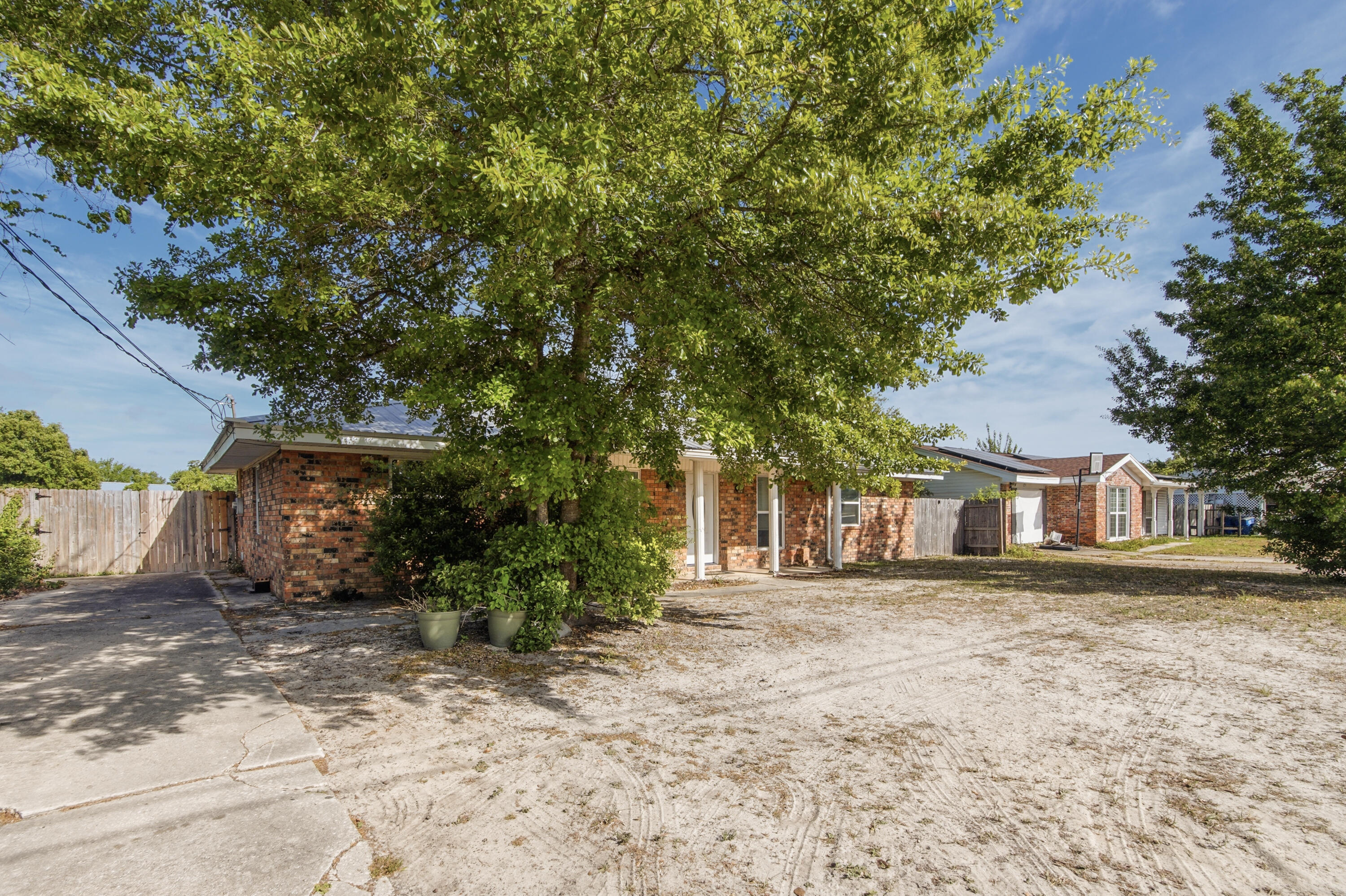 1247 Amherst Road Panama City, FL 32405 - Photo 3 of 28 a front view of a house with a yard