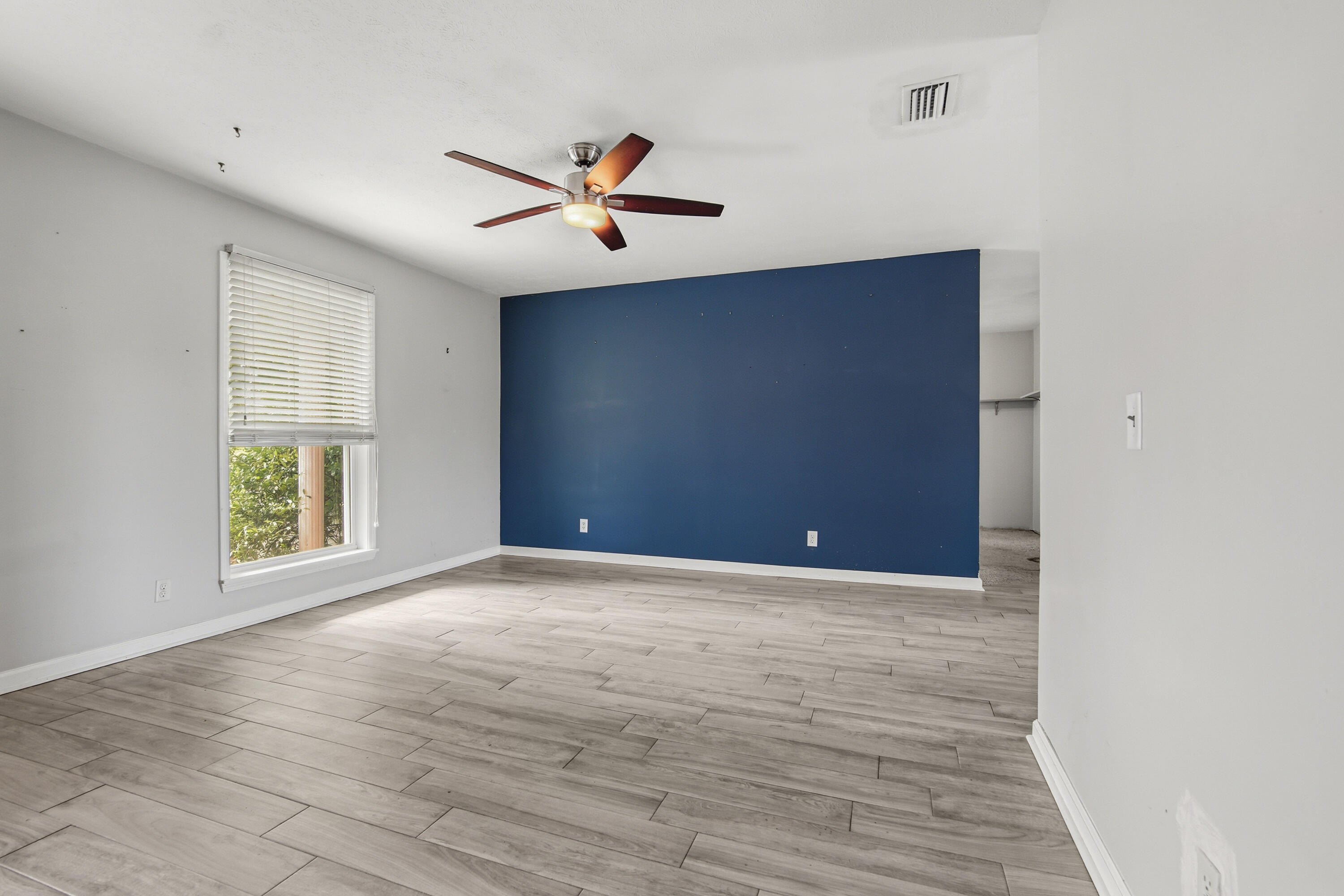 1247 Amherst Road Panama City, FL 32405 - Photo 6 of 28 a view of an empty room with a window