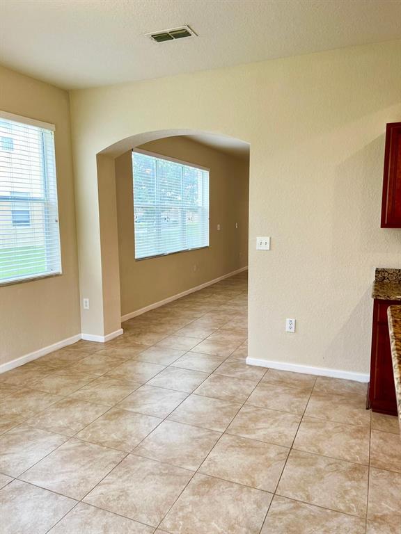 2992 Langdon Lane South Kissimmee, FL 34741 - Photo 15 of 39 a view of an empty room with a window