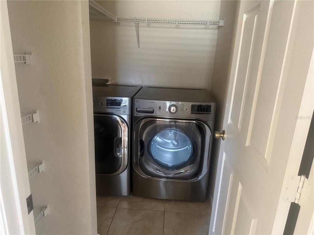 2992 Langdon Lane South Kissimmee, FL 34741 - Photo 30 of 39 a utility room with dryer and washer