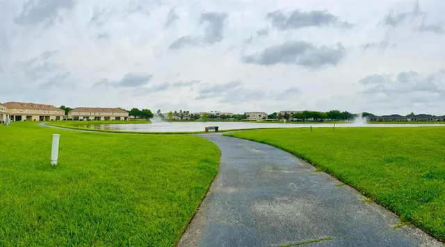 a view of a golf course with a lake