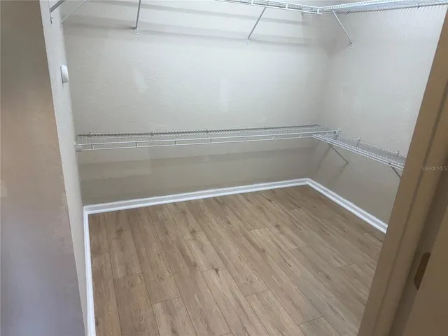 a view of an empty walk in closet