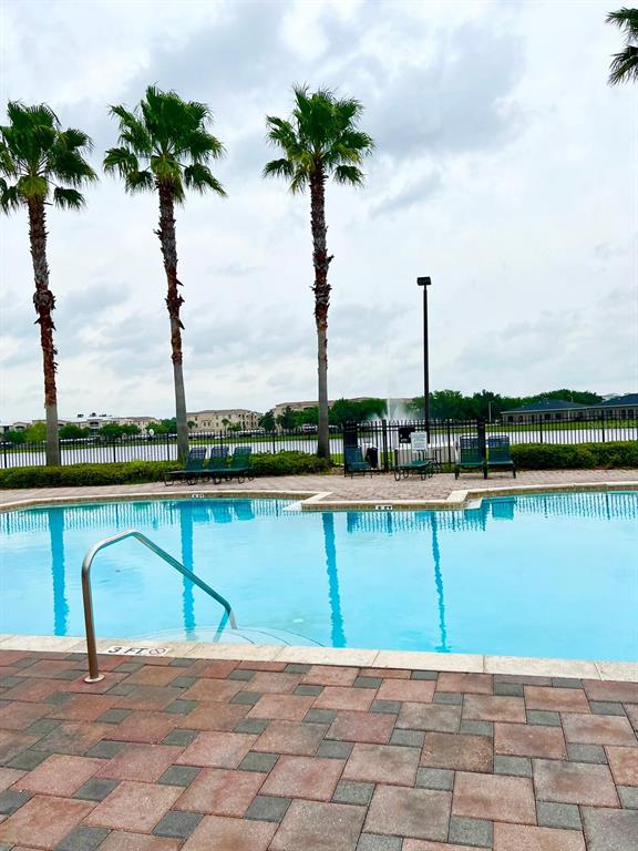2992 Langdon Lane South Kissimmee, FL 34741 - Photo 7 of 39 a view of a lake with a beach