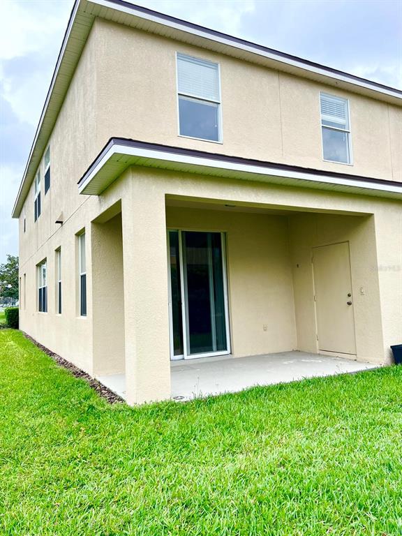 2992 Langdon Lane South Kissimmee, FL 34741 - Photo 8 of 39 a front view of a house with garage