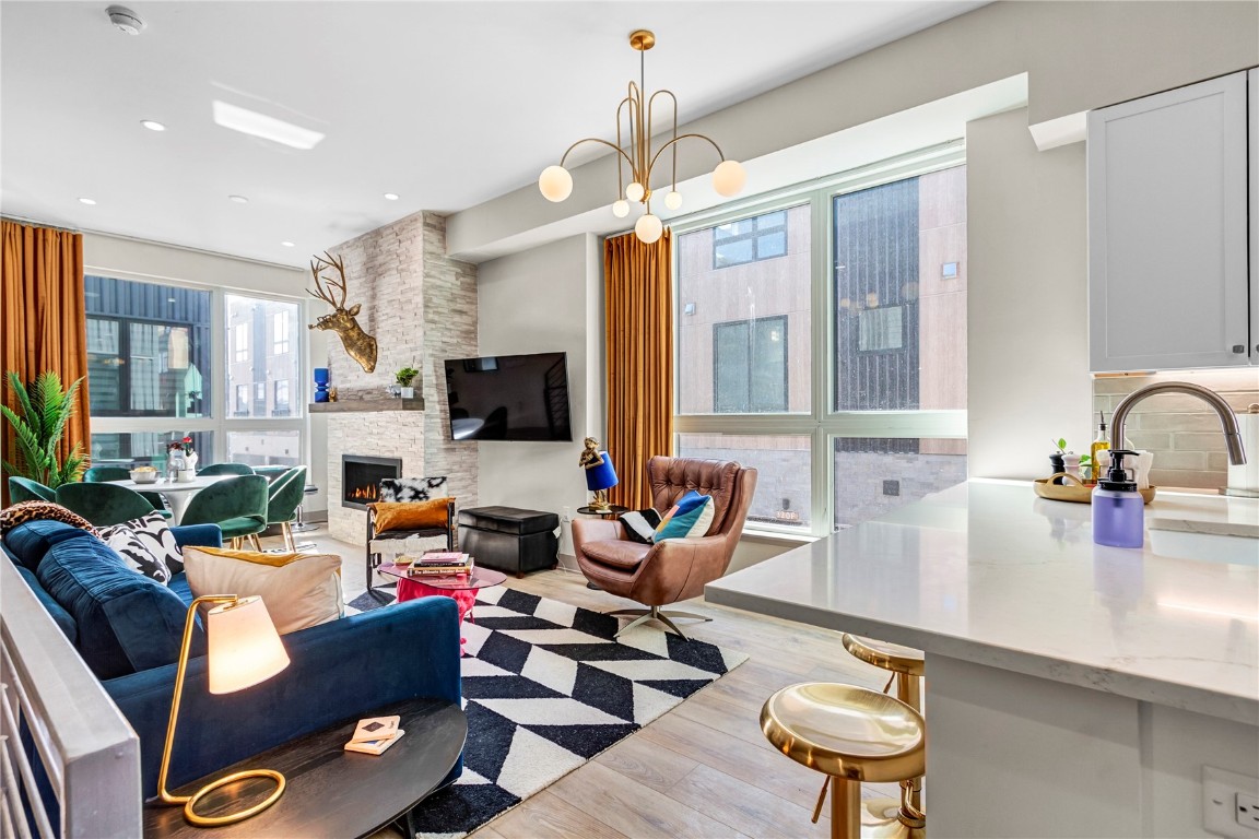 a kitchen with stainless steel appliances kitchen island granite countertop a sink and cabinets