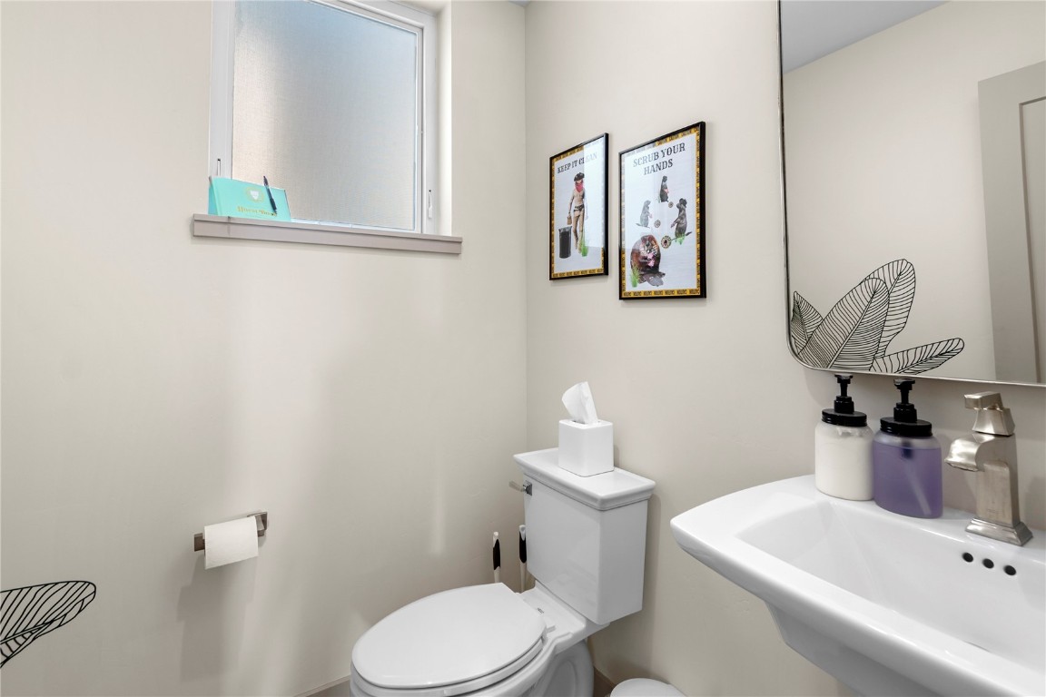 58 3rd Street, Unit D Silverthorne, CO 80498 - Photo 13 of 29 a bathroom with a sink mirror and toilet